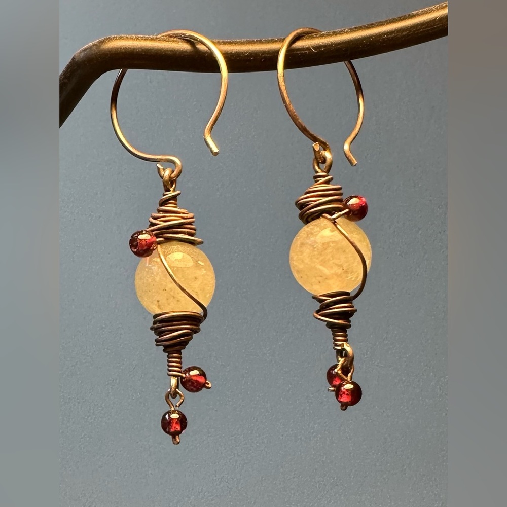 Pale Green Bead Earrings with Silver Wire and purple accent beads.